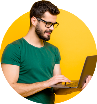 Image of smiling man holding laptop